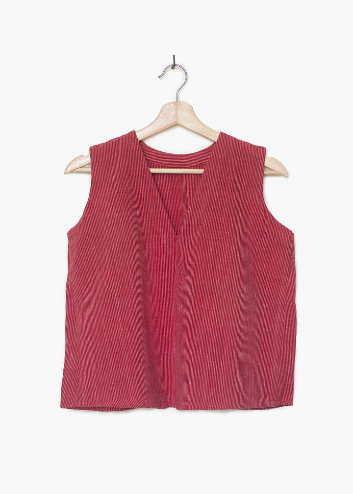 A red sleeveless top with a v neck